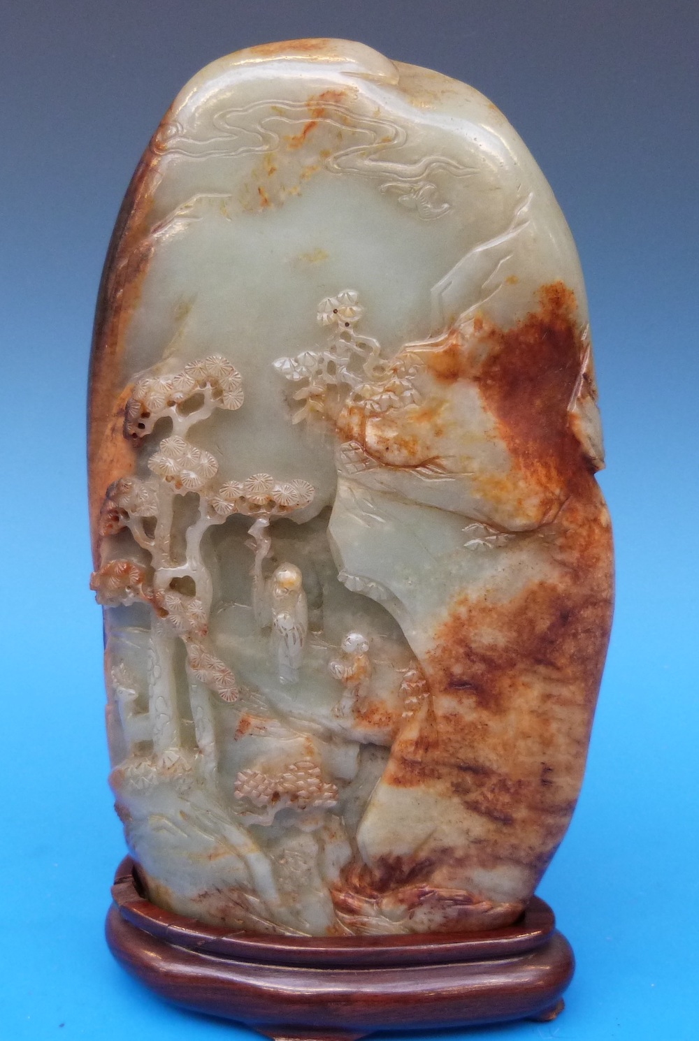 An 18Thc Chinese Jade Boulder Carved With Mountainous Landscape, Sage And Pine Trees, On Fitted Wooden Stand (21Cm Excluding Stand) Sold For £17,000