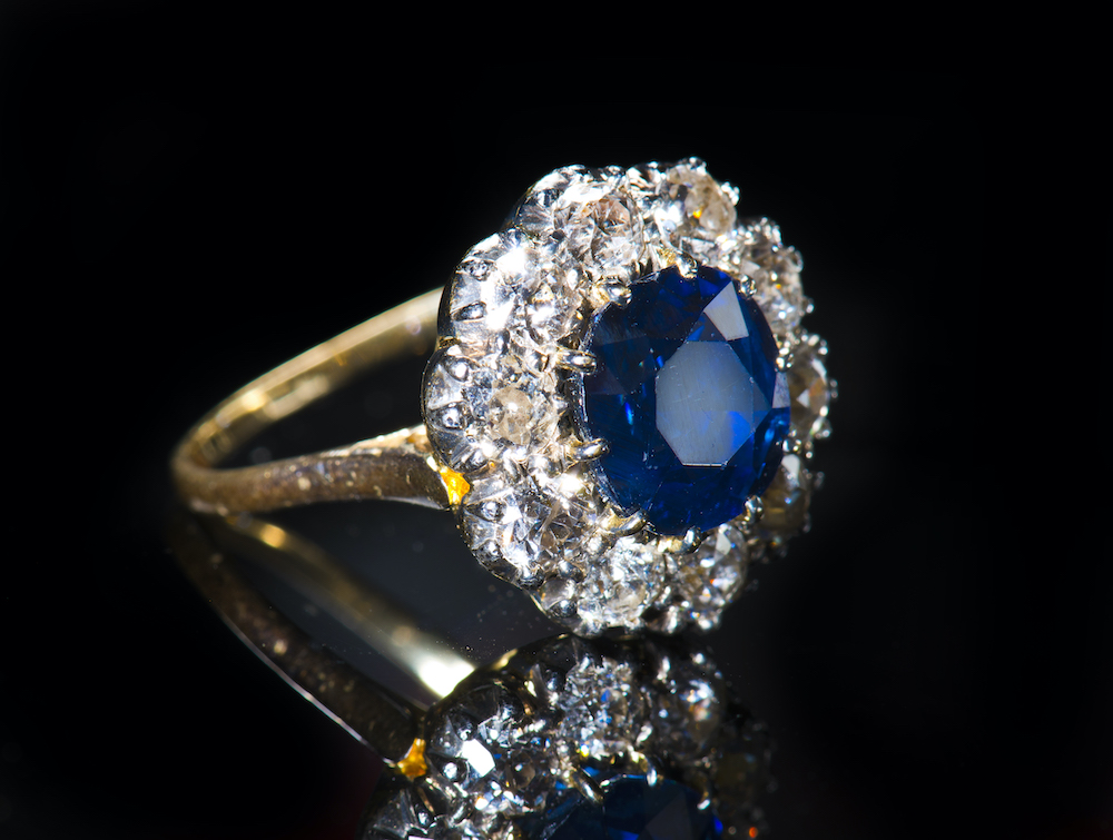 An 18Ct Gold Ring Set With A Natural Untreated Sapphire Surrounded By Diamonds. Sold For £5,000