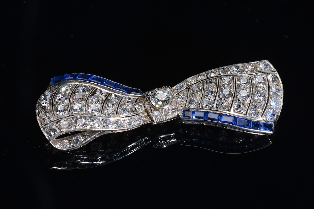 An Exceptional Art Deco Platinum Brooch In The Form Of Bow Set With Diamonds And Sapphires. Sold For £3,000