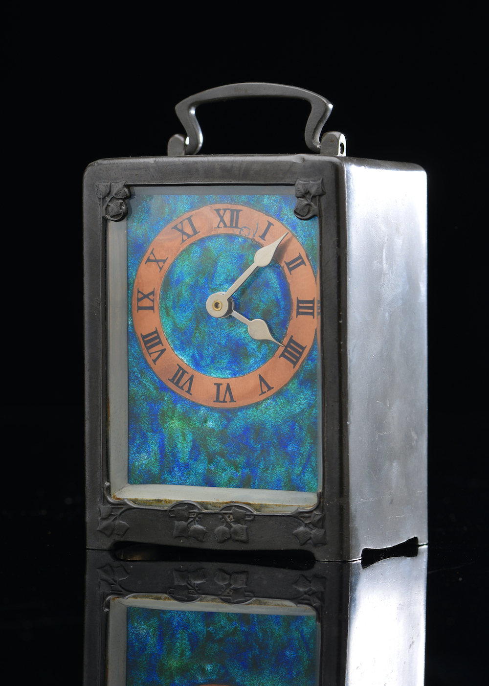 An Archibald Knox Liberty Clock With Arts And Crafts Pewter Case . Sold For £1200