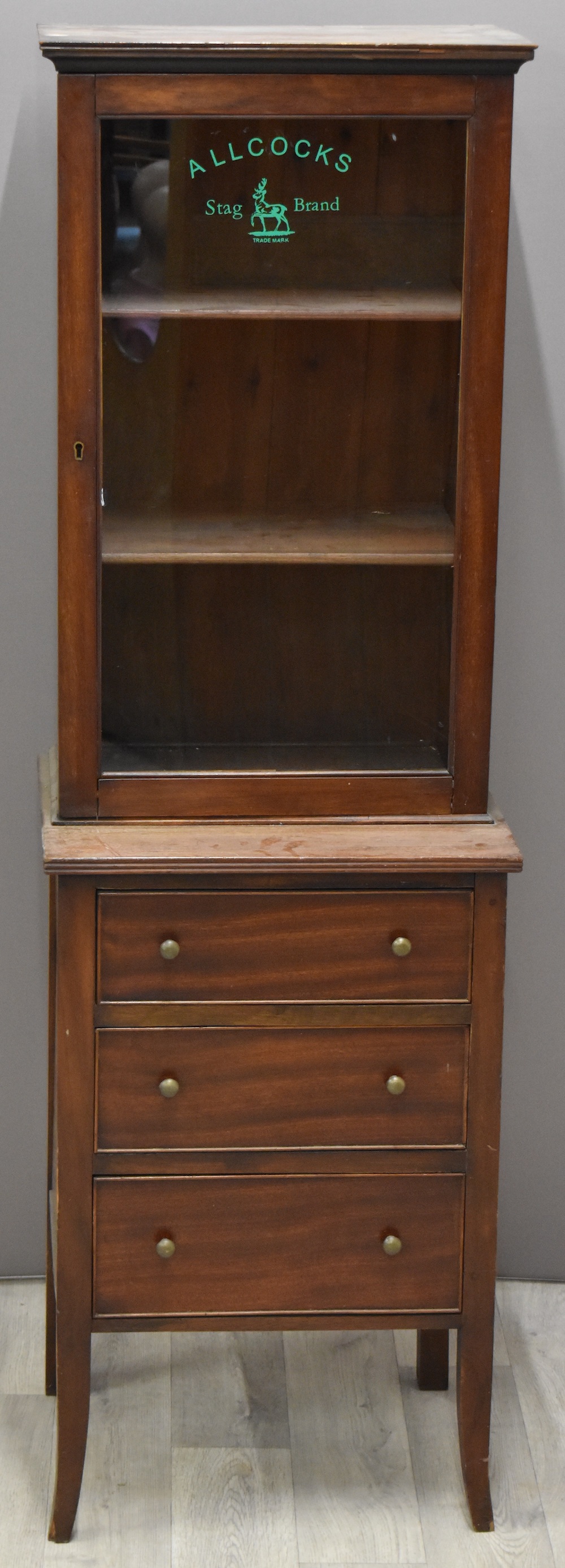 A Mahogany Glazed Allcocks Shop Advertising Cabinet. Sold For £130