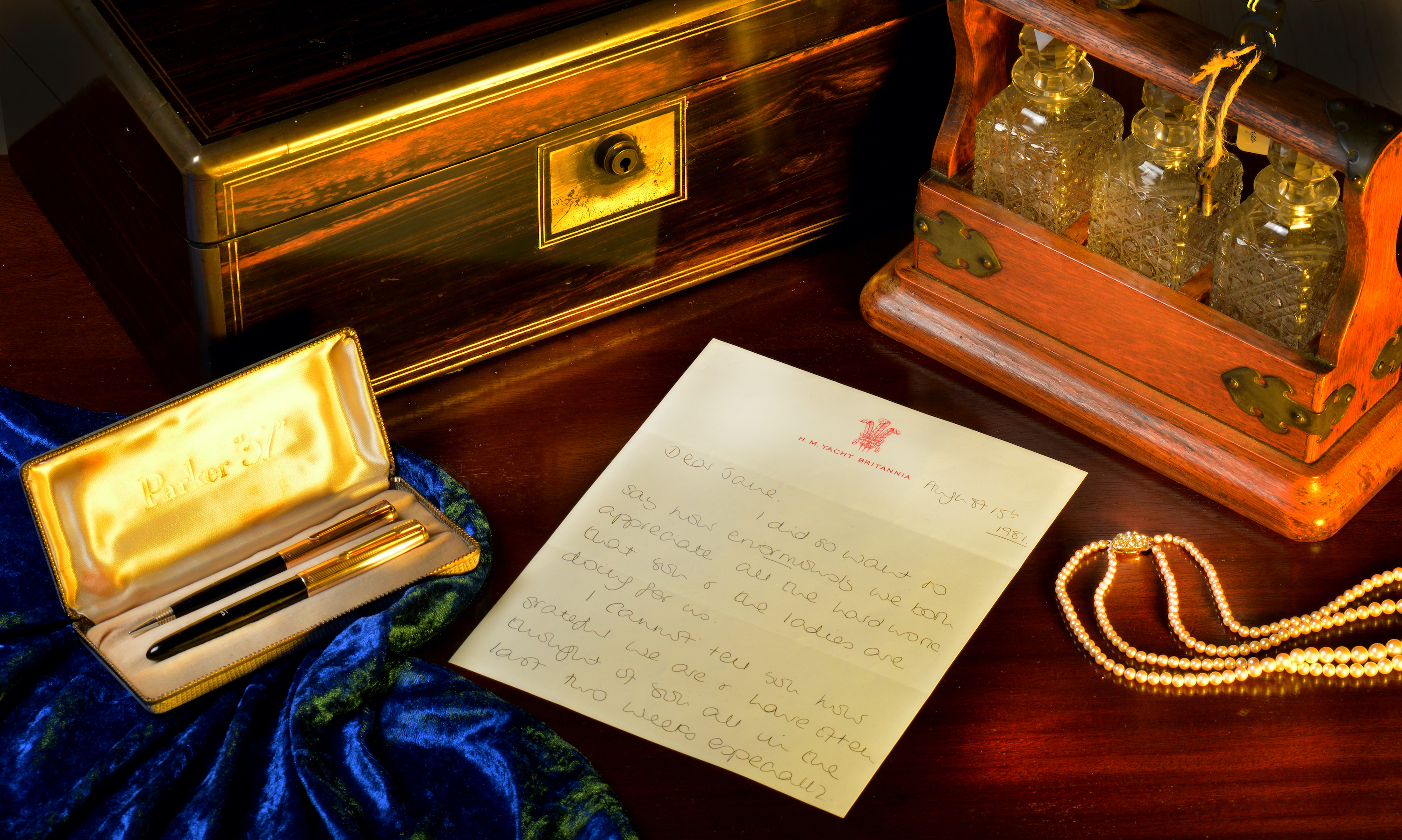 Desk of antique letterset, pens and ink bottles