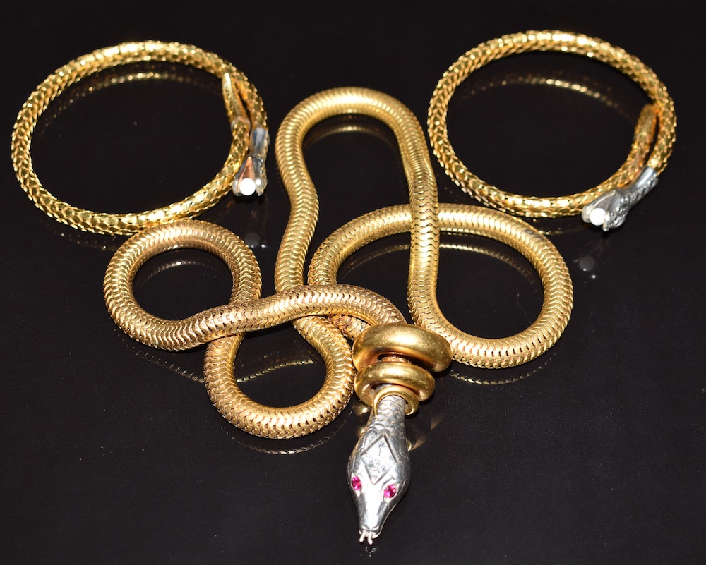 A Vintage Serpent Necklace With Synthetic Ruby Eyes And Two Rolled Gold Art Deco German Serpent Bangles. Sold For £420